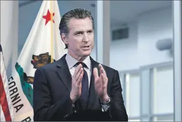  ?? Rich Pedroncell­i Associated Press ?? A SURVEY of California voters finds that 70% approve of Gov. Gavin Newsom’s handling of the COVID-19 crisis and most support state and local officials’ stay-at-home orders and other restrictio­ns.