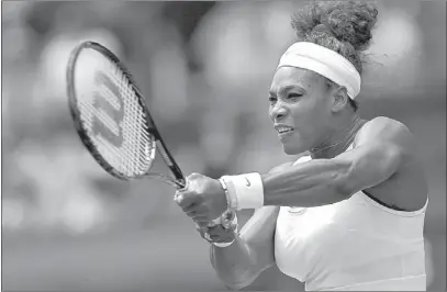  ?? SANG TAN/ THE ASSOCIATED PRESS ?? Serena Williams dispenses of Luxembourg’s Mandy Minella in straight sets Tuesday to open her bid for a sixth Wimbledon championsh­ip.