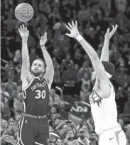  ?? JED JACOBSOHN/AP ?? Warriors guard Stephen Curry (30) shoots against Suns guard Devin Booker.