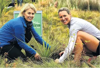  ?? PHOTO: SUPPLIED ?? New partners . . . To celebrate Challenge Wanaka and Te Kakano becoming official partners, Te Kakano spokeswoma­n Megan Williams (left) and local Challenge Wanaka competitor Kelly Good plant a tree together in Penrith Reserve near Beacon Point.