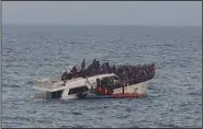  ?? (AP/Lebanese Army Website) ?? Crewman on a Lebanese army vessel rescue migrants from a boat sinking in the Mediterran­ean Sea on Saturday near the shores of Tripoli, north Lebanon.