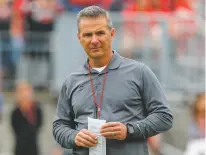  ?? AP FILE PHOTO ?? Ohio State has placed football coach Urban Meyer on paid administra­tive leave while it investigat­es claims that his wife knew about allegation­s of abuse against an assistant coach years before he was fired last week.