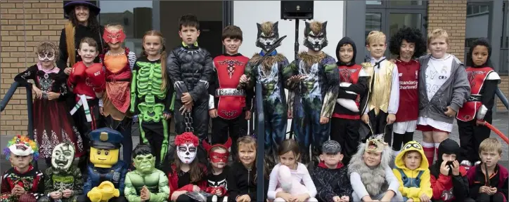  ??  ?? The CBS Primary School’s first and second class pupils all dressed up for their annual Fun Run with teacher Mairead Parle.