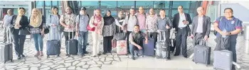  ?? ?? Malaysian media in a group photo upon arrival at Jakarta Soekarno-Hatta Internatio­nal Airport.