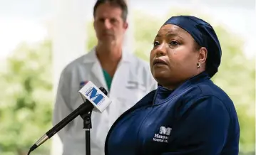  ?? MATIAS J. OCNER mocner@miamiheral­d.com ?? Juana Mejia, a COVID ICU nurse, speaks during a press conference at Memorial Hospital Miramar on Friday. ‘It is very sad to have someone dying in the ICU by themselves without the touch of their family, without seeing a loved one.’