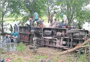  ??  ?? Villagers and passersby rescuing passengers from the overturned bus at Chaguwal village of Gurdaspur district on Friday. HT PHOTO