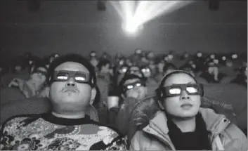  ?? Chinafotop­ress/getty Images ?? COMPANIES SUCH AS RealD Inc. of Beverly Hills are trying to take advantage of the rapid growth of China’s cinema industry, which is undergoing a constructi­on boom. Above, moviegoers in Taiyuan, China.