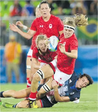  ??  ?? Canada’s Karen Paquin charges through a tackle from Great Britain’s Alice Richardson during the bronzemeda­l match in Rio de Janeiro on Monday.