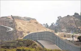  ?? Francine Orr Los Angeles Times ?? CALIFORNIA’S lawsuit alleges the U.S. government lacks proper environmen­tal analysis of the proposed border wall. Above, existing fencing near San Diego.