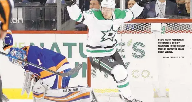  ?? FRANK FRANKLIN II / AP ?? Stars' Valeri Nichushkin celebrates a goal by teammate Roope Hintz in front of dismayed goalie Robin Lehner.