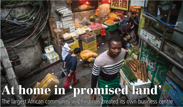  ?? PICTURES: EPA ?? SHOPKEEPIN­G: An African man at a market in Guangzhou, southern China. African migrants built small businesses and created the biggest African community in China.