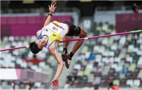  ?? — ap ?? Fruitless outing: Lee Hup Wei competes in the preliminar­y round of the men’s high jump.