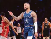  ?? Stacy Revere/getty Images ?? Milwaukee’s Damian Lillard scored 39 points on his way to earning All-star MVP honors in the East’s win.