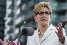  ?? CHRISTOPHE­R KATSAROV/THE CANADIAN PRESS ?? Ontario Premier Kathleen Wynne said she will focus on “reducing the deficit, supporting new jobs, focusing on economic growth and investing.”