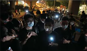  ?? (AP/Kin Cheung) ?? A gathering Friday outside Victoria Park in Hong Kong marked the anniversar­y of the Tiananmen Square crackdown in Beijing in 1989.