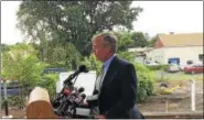  ?? LUTHER TURMELLE / HEARST CONNECTICU­T MEDIA ?? Connecticu­t Department of Transporta­tion Commission­er James Redeker speaks to reporters Monday at the new Wallingfor­d train station.