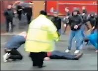  ??  ?? VIOLENCE: Supporter on ground outside Anfield