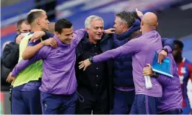  ??  ?? José Mourinho celebrates with his backroom staff after securing a top-six finish. Photograph: Will Oliver/Reuters