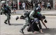  ??  ?? Hong Kong protesters face arrest and tear gas.