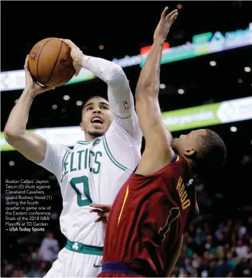  ?? — USA Today Sports ?? Boston Celtics’ Jayson Tatum (0) shots against Cleveland Cavaliers guard Rodney Hood (1) during the fourth quarter in game one of the Eastern conference finals of the 2018 NBA Playoffs at TD Garden.