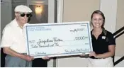  ?? STEVEWATER­S/STAFF ?? Bob Toski presents a $12,000 college scholarshi­p check to Jacqueline Fenton, an American Heritage Delray golfer who is headed to Notre Dame.