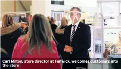  ??  ?? Carl Milton, store director at Fenwick, welcomes customers into the store