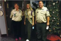  ?? EDMUND TUNNEY VIA THE ASSOCIATED PRESS ?? Isabella Tunney with Bev Verweg, her scoutmaste­r, and Brian Reiners, scoutmaste­r of a correspond­ing linked boy troop, in Edina, Minn. Tunney is one of nearly 1,000 females honored in the U.S. as Eagle Scouts.