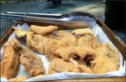  ?? NWA Democrat-Gazette/FLIP PUTTHOFF ?? A mess of fried trout combined with vegetables from the garden is a delicious way to live off the land, for one meal at least.