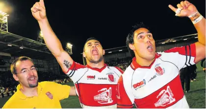  ??  ?? ROBINS SING WITH JOY: Pictures taken after the National League One Grand Final between Hull Kingston Rovers and Widnes Vikings, played at the Halliwell Jones Stadium, Warrington, in 2006. Robins players celebrate their win over the Vikings, with Byron Ford and David Tangata-toa.