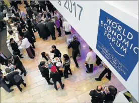  ?? Picture: REUTERS ?? POWERFUL GROUP: Delegates take a lunch break during the World Economic Forum (WEF) annual meeting in Davos, Switzerlan­d