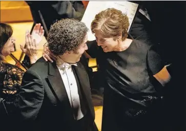  ?? Patrick T. Fallon For The Times ?? THEN-L.A. Phil President Deborah Borda shares a joyful moment with conductor Gustavo Dudamel in 2017.