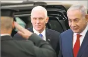  ?? ARIEL SCHALIT — THE ASSOCIATED PRESS ?? U.S. Vice President Mike Pence walks with Israel’s Prime Minister Benjamin Netanyahu in Jerusalem on Monday.