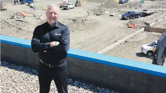  ??  ?? Fred Weiss, executive director of Samaritan’s Purse, is watching the constructi­on of a new warehouse facility to house the organizati­on’s disaster response units. It will be adjacent to its current building in the northeast.