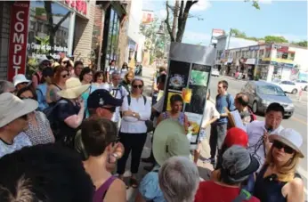  ?? KATIE DAUBS/TORONTO STAR ?? Jason Lee, a tour guide with Heritage Toronto, leads a walking tour along Bloor St. W., through Koreatown.