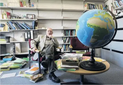  ?? PHOTO: GERARD O’BRIEN ?? Retirement looms . . . University of Otago geography professor Tony Binns takes a break from clearing his office space of 17 years.