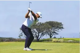  ?? K.C. ALFRED U-T ?? Four-time major Brooks Koepka, who had four birdies and two bogeys, tees off on the 16th hole during the first round of the U.S. Open at Torrey Pines on Thursday.