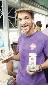  ?? JERMAINE BARNABY/ FREELANCE PHOTOGRAPH­ER ?? Norman Wright, managing director, Perishable­s Jamaica Limited, showing of his brand of teas at the 65th staging of Denbigh Agricultur­al Show on Sunday, August 6.