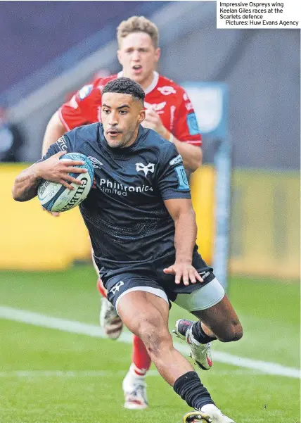  ?? ?? Impressive Ospreys wing Keelan Giles races at the Scarlets defence
Pictures: Huw Evans Agency