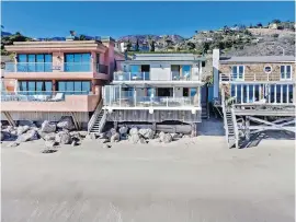  ??  ?? Leonardo DiCaprio’s home on Carbon Beach in Malibu, centre, has been leased out for $22,000 US a month.
