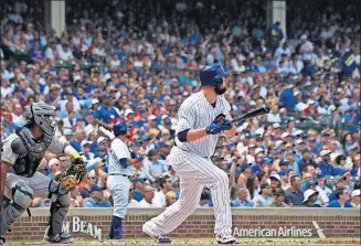  ?? [DAVID BANKS/THE ASSOCIATED PRESS] ?? Chicago’s Jon Lester watches his two-run single during Saturday’s game against Pittsburgh.