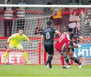  ??  ?? FLOWING JORDAN Crawley’s Jordan Roberts beats two Yeovil defenders to find the net