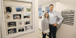  ??  ?? Right: The couple in the airy entryway to the condo. Ashley’s sister found the frame in the garbage, and Ashley refinished it as a photo display area.