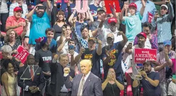  ?? Drew Anthony Smith Getty Images ?? A CROWD of supporters cheers Donald Trump in Austin, Texas, this week. As Trump revises his policy on whether to deport all immigrants in the U.S. illegally, some are skeptical he’ll ever stake out a clear position.