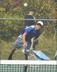  ?? The Sentinel-Record/Richard Rasmussen ?? RAM FAVORITE: Lakeside’s Ben Hollis serves the ball during the second round of the 5A-South conference tennis tournament at Lakeside on Oct. 6. Hollis is the top-seeded player for the Class 5A state tournament, which starts today at Hot Springs Country Club.