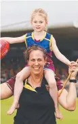  ?? Picture: BRENDAN RADKE ?? CHEER SQUAD: Jo Butland, with four-year-old Bailey Gibbs, will be in Brisbane cheering the Lions in the inaugural AFLW decider.