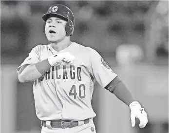  ?? GARY A. VASQUEZ, USA TODAY SPORTS ?? Willson Contreras pounds his chest after his RBI single ended the Cubs’ 21-inning scoring drought Wednesday and jump-started their 10-2 victory against the Dodgers in Game 4.