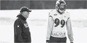  ?? KENNETH K. LAM/BALTIMORE SUN ?? Ravens outside linebacker Matthew Judon, right, talks with defensive coordinato­r Dean Pees during practice at the Under Armour Performanc­e Center on Wednesday.