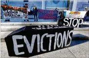  ??  ?? Tenants’ rights advocates demonstrat­e in front of the Edward W. Brooke Courthouse in Boston on Jan. 13.