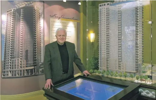  ?? SUN-TIMES FILES ?? Architect Jim Loewenberg in 2003 with models of one of his buildings at 1 W. Superior St.