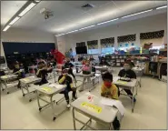  ?? PHOTO COURTESY OF NORTH PENN SCHOOL DISTRICT ?? Students at York Avenue Elementary School in Lansdale sport masks during their “Reading is Fundamenta­l” day on Feb. 11.